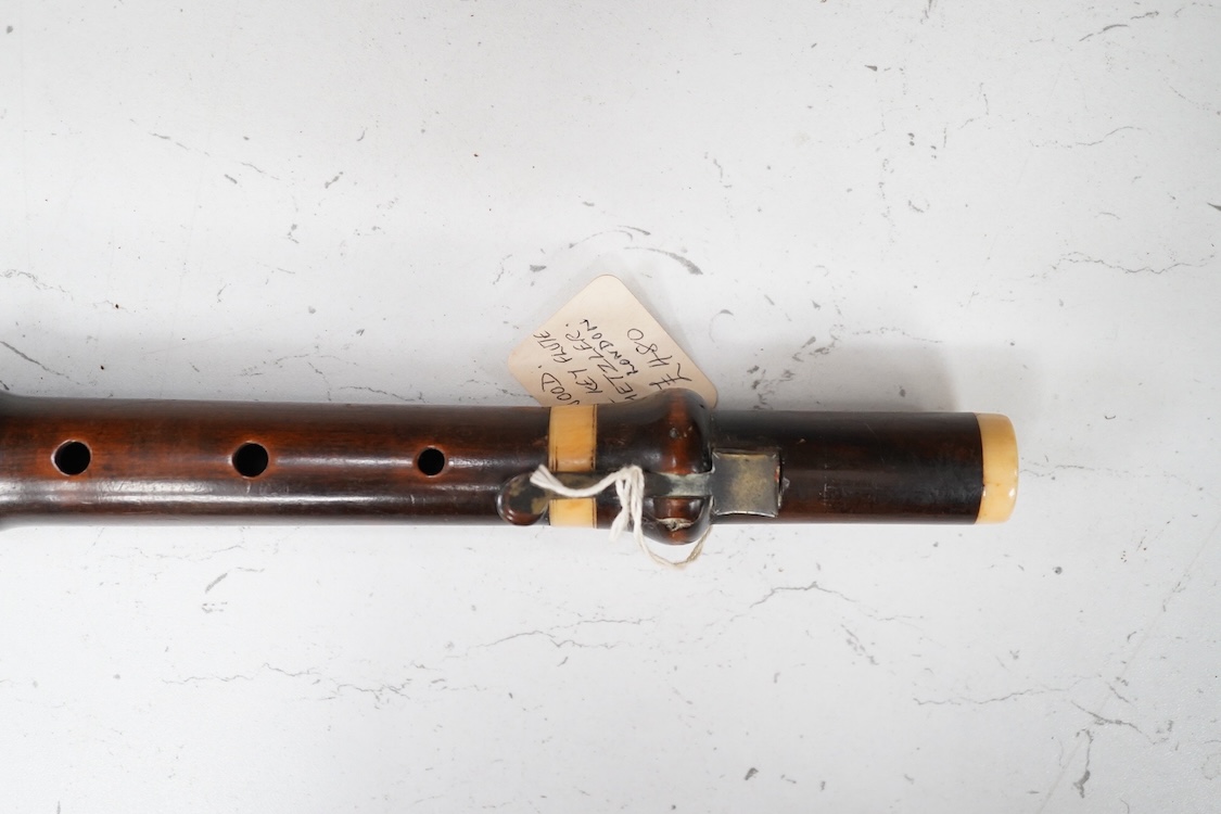 A 19th century crocus wood and ivory flute possibly by Metzler, six holes and one key to the foot joint, 60.5cm long, ivory submission ref: HMMH3U4M